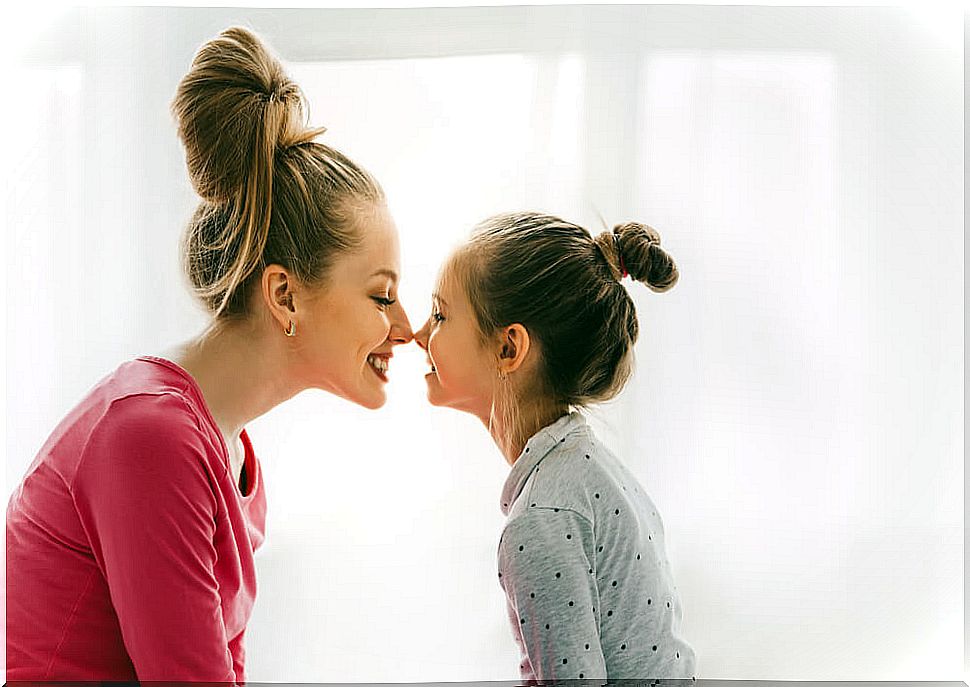 Mother and daughter giving an Eskimo kiss one of the beautiful experiences of being a mother.