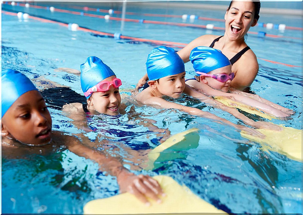 Nervous children practicing swimming.