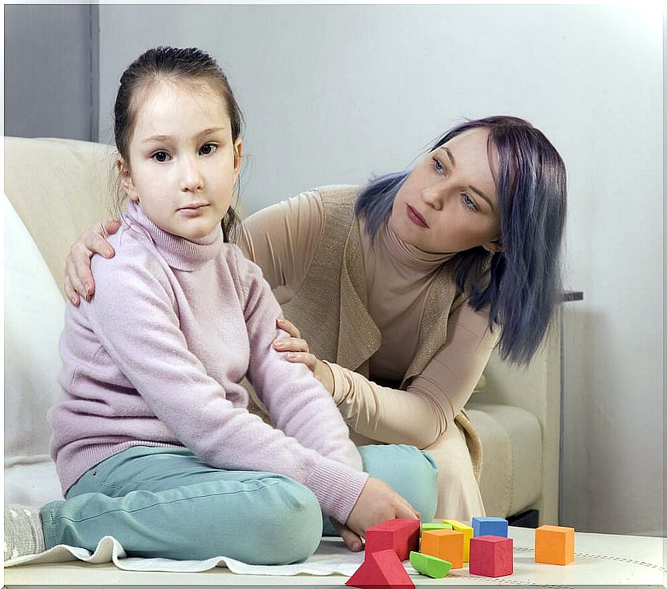 Mother with her daughter with autism carrying out one of the intervention programs.