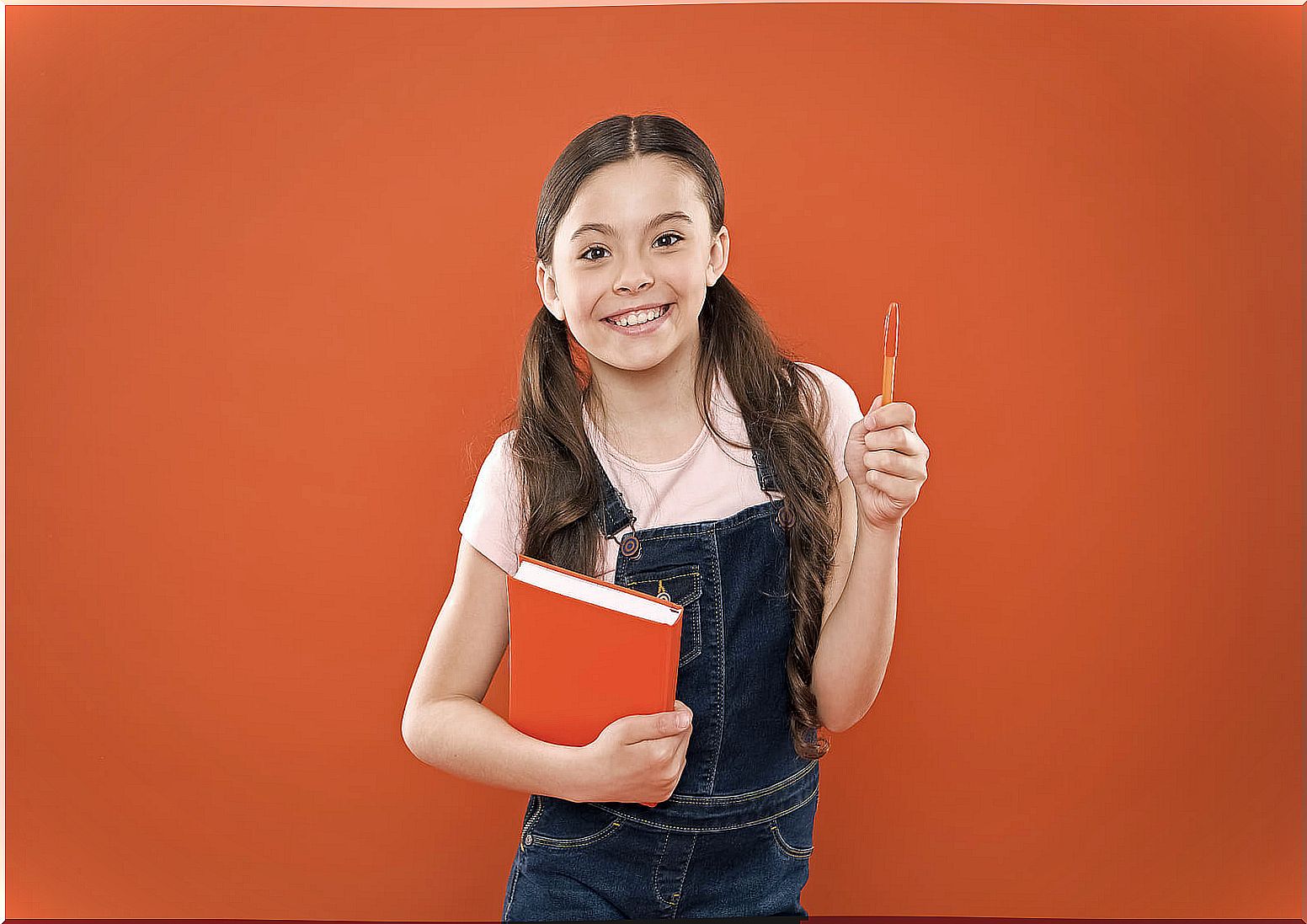 Girl happy with her new school agenda.