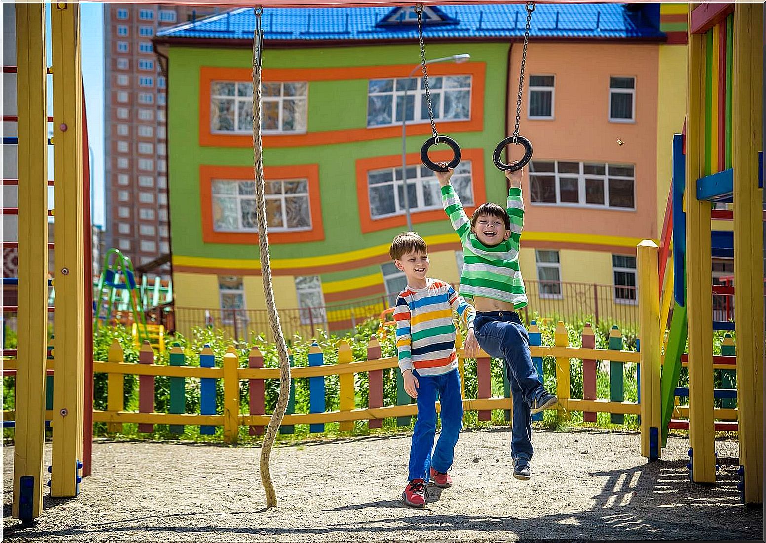 Children playing on the swings cultivating the value of friendship.