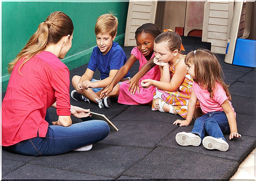 Teacher with her students teaching conflict resolution strategies.