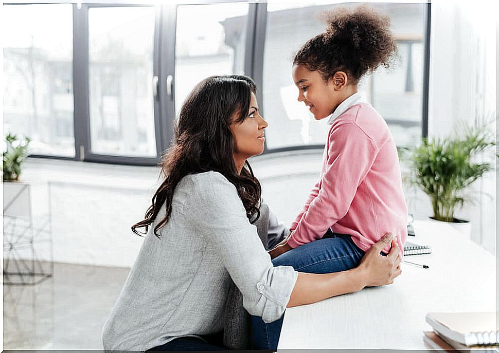 Mother talking with her daughter about the value of discretion.