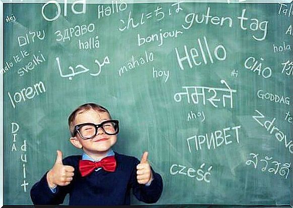 happy-boy-with-blackboard-with-letters-many-languages