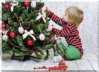 Boy riding christmas tree