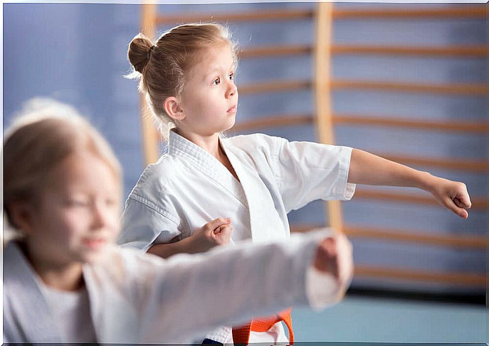 Girl learning judo in one of the extracurricular activities she attends.