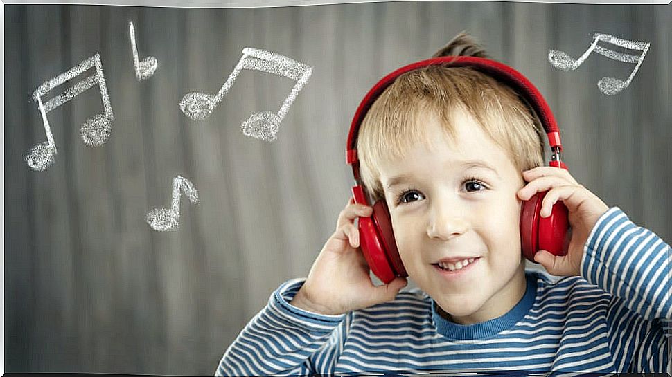 Child listening to music because it is beneficial for children's cognitive development.