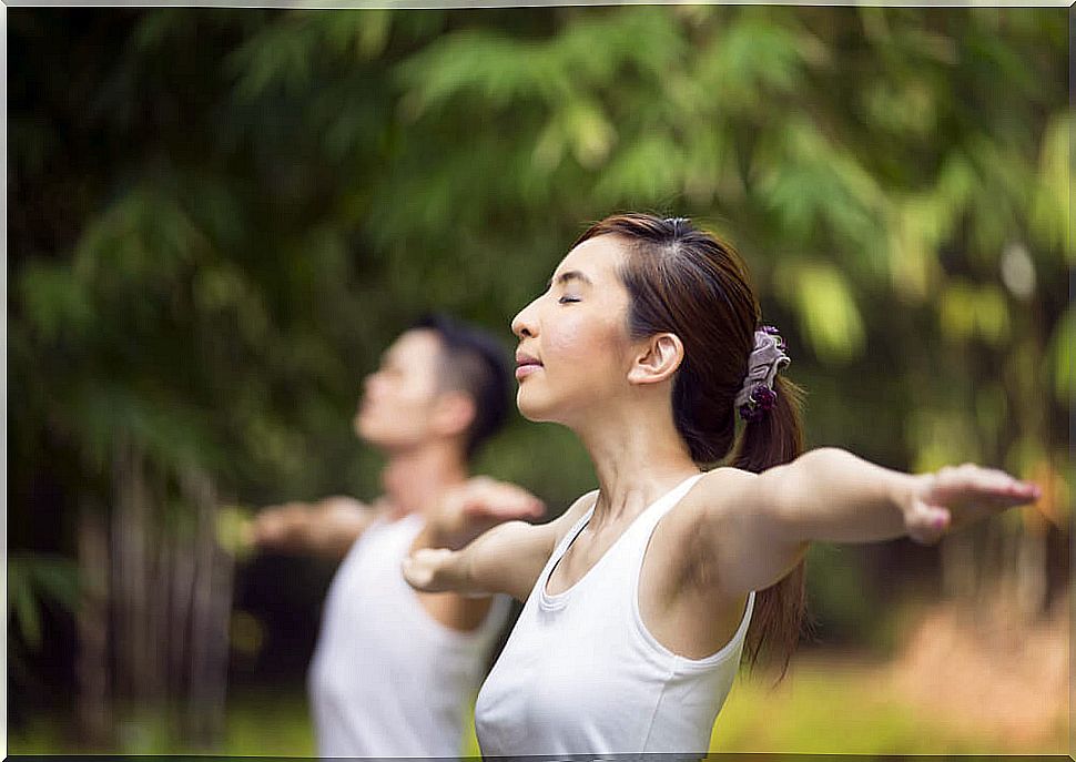 Woman doing tai chi.