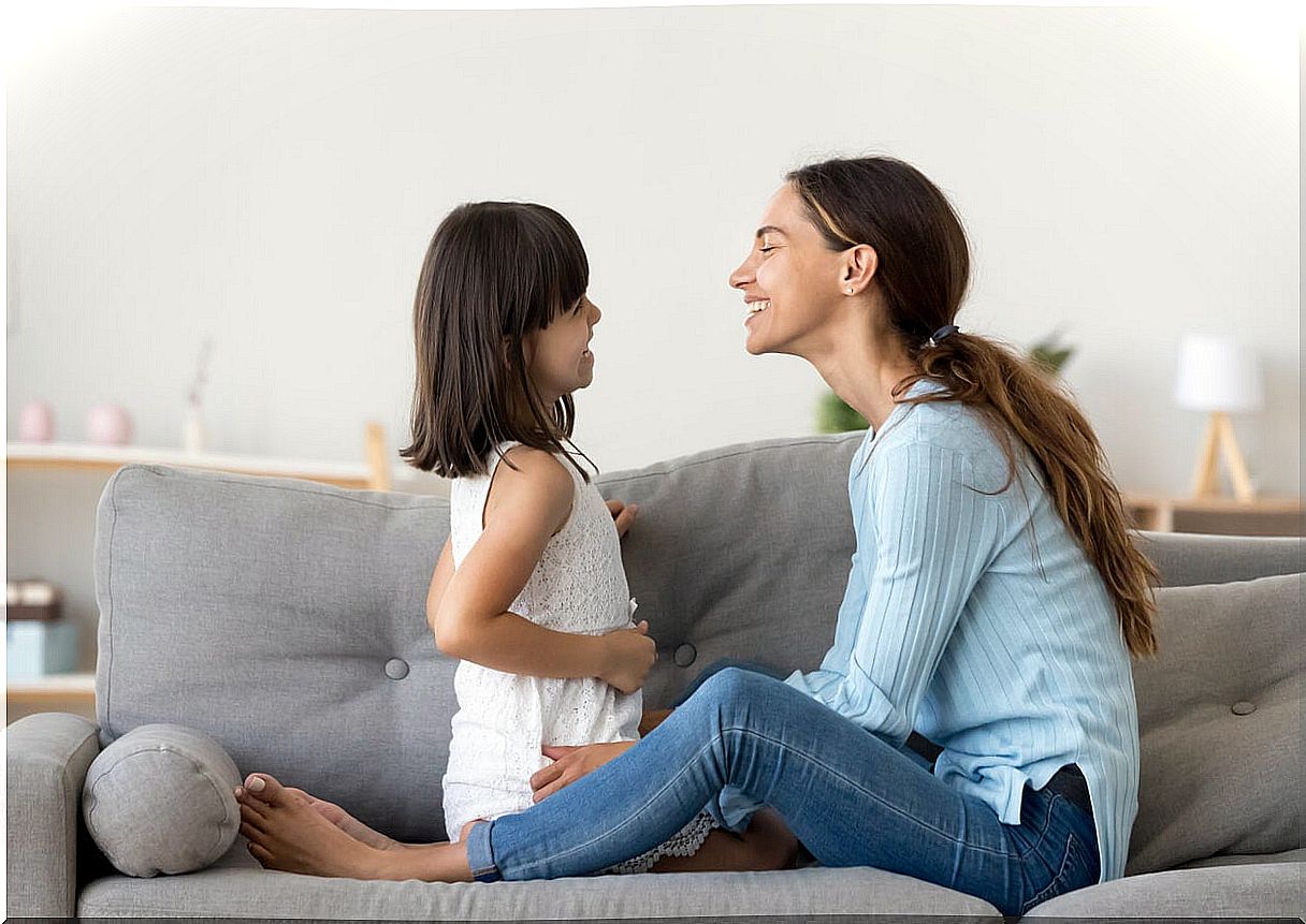 Mother having fun chatting with her daughter.