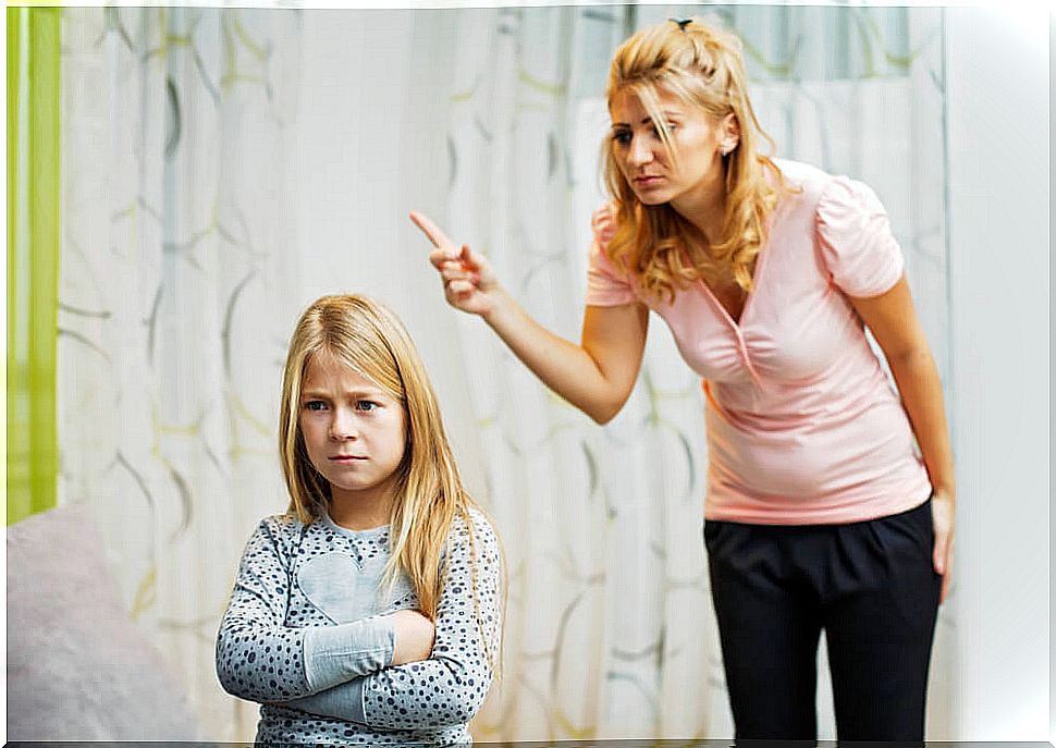 Mother scolding her daughter and paying for her frustrations with her.