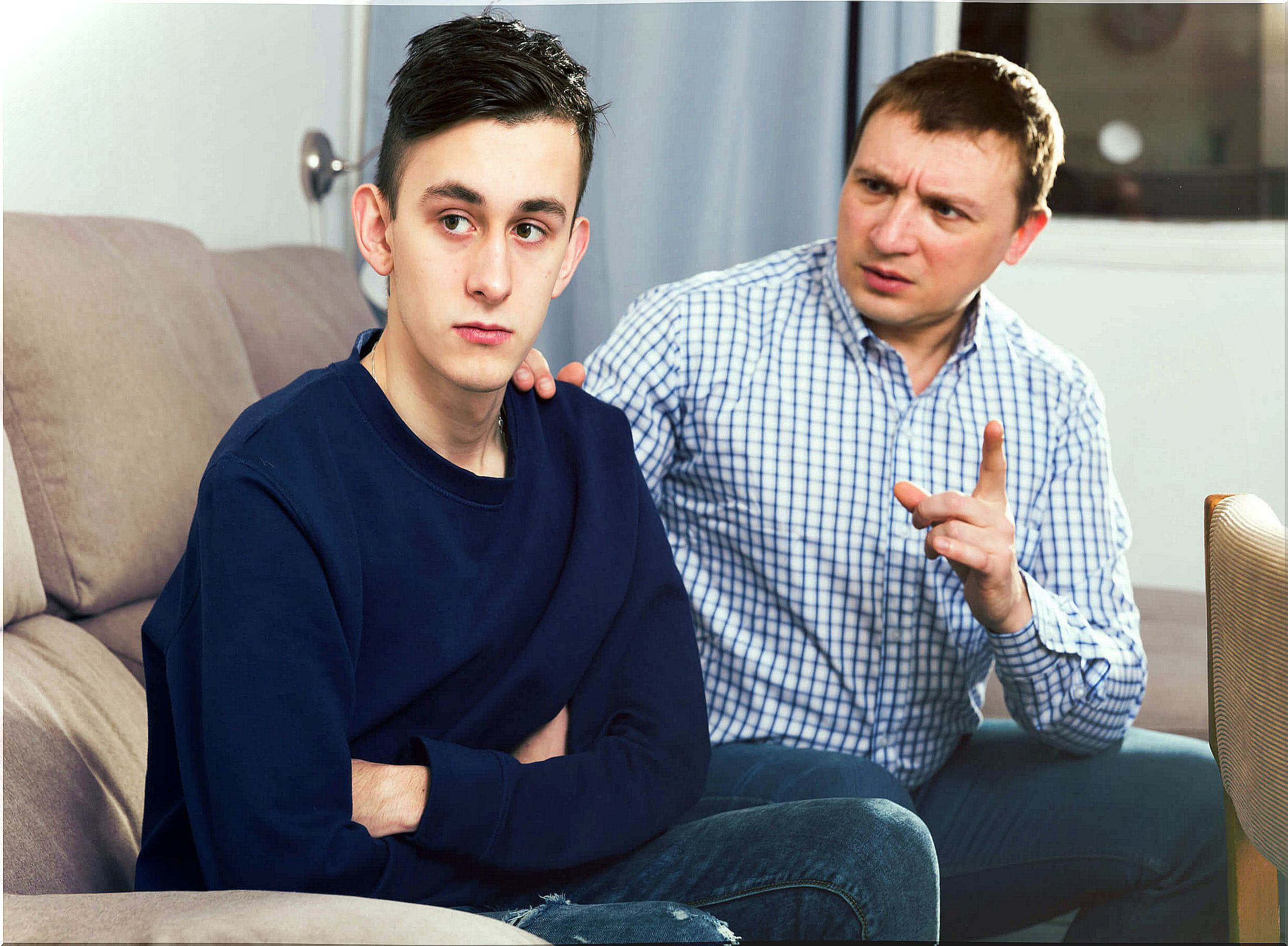 Father talking to his teenage son about limits because there is still a child within him.