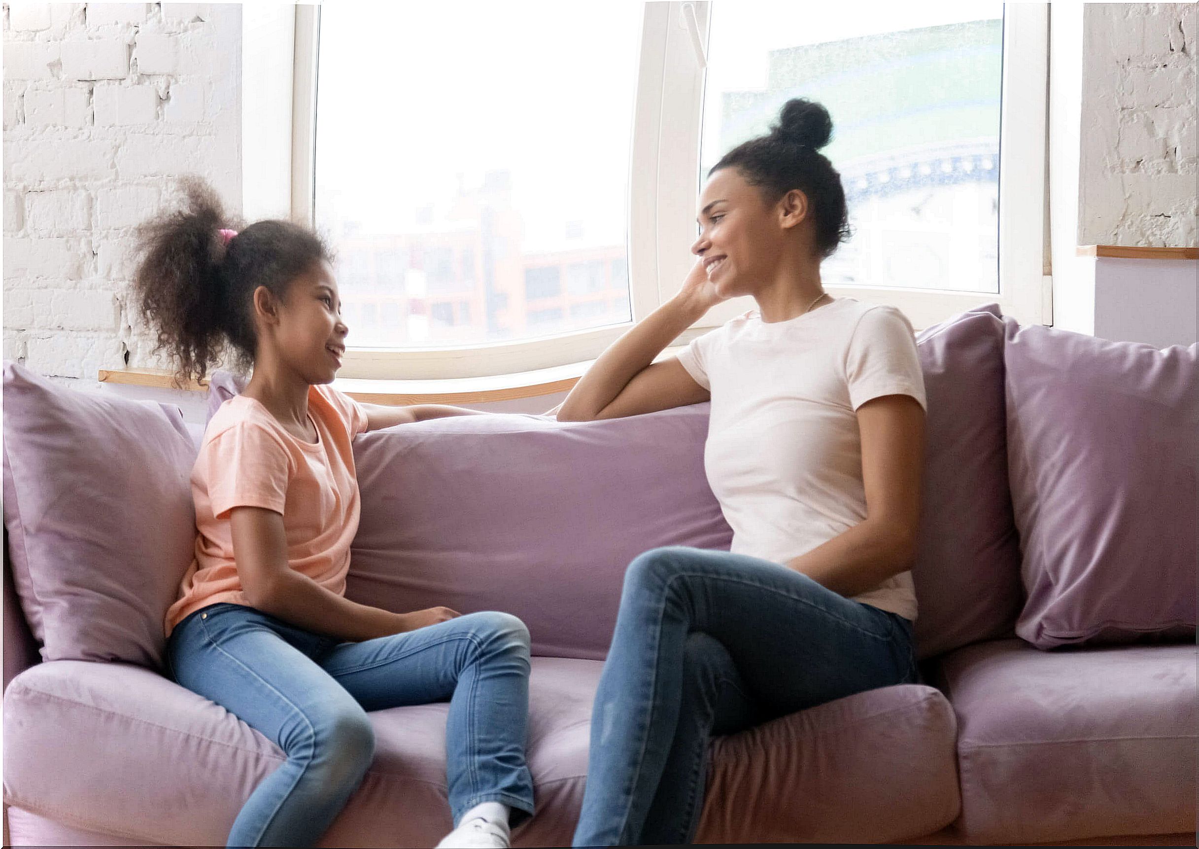 Mother chatting with her teenage daughter.